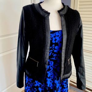 Black tweet and leather jacket